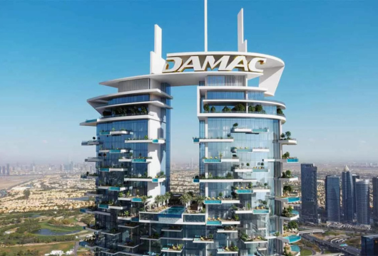 Aerial view of the luxurious Damac Hills community with lush green golf courses, elegant villas, and a serene lake in Dubai